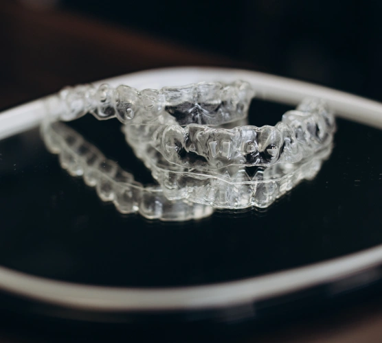 Custom clear nightguards at Ro Dental Group in Calgary, Alberta, designed to protect teeth from grinding and clenching during sleep.