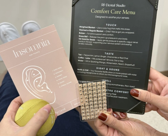 Patient exploring the Rō Dental Studio Comfort Care Menu featuring personalized comfort amenities designed to create a relaxing dental experience in Calgary, AB.