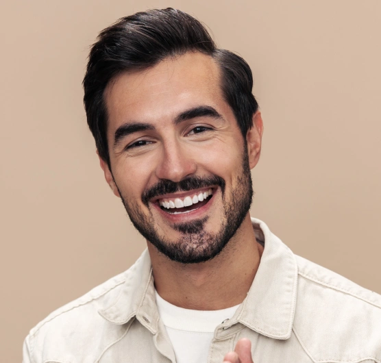 Restorative dentistry patient with a healthy smile after treatment at Rō Dental Studio in Calgary