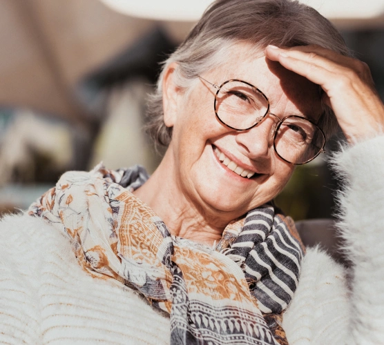 Portrait of a smiling patient representing compassionate tooth extraction care at Ro Dental Group in Calgary, AB.